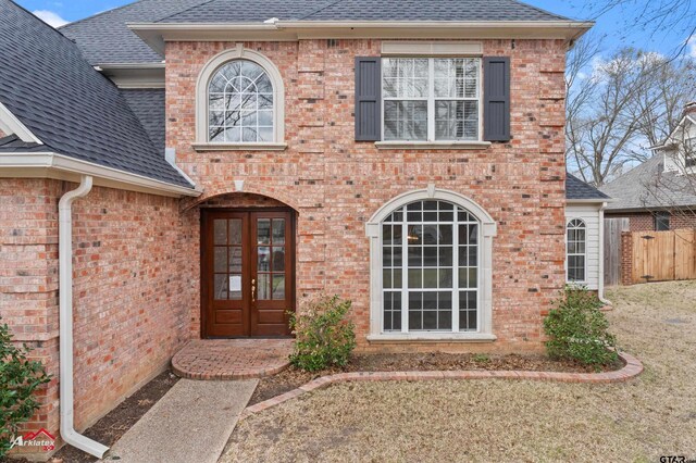 6309 Gleneagles, Tyler, TX 75703 - entrance to property featuring brick siding, french doors, and roof with shingles
