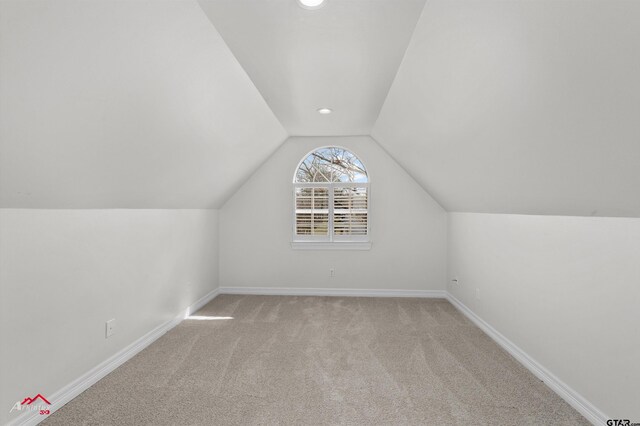 6309 Gleneagles, Tyler, TX 75703 - additional living space featuring carpet, baseboards, and vaulted ceiling