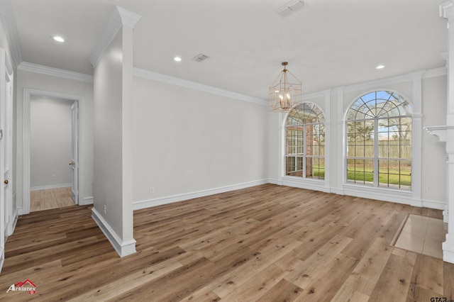 6309 Gleneagles, Tyler, TX 75703 - unfurnished dining area with a notable chandelier, hardwood / wood-style flooring, crown molding, and visible vents