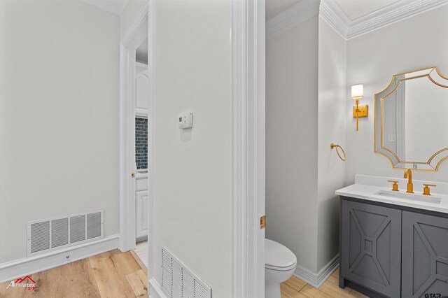 6309 Gleneagles, Tyler, TX 75703 - bathroom with visible vents, crown molding, and wood finished floors