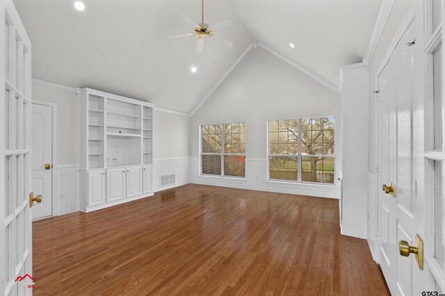 6309 Gleneagles, Tyler, TX 75703 - unfurnished living room featuring a ceiling fan, wainscoting, wood finished floors, and visible vents