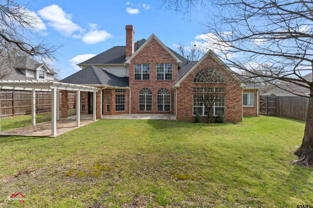 6309 Gleneagles, Tyler, TX 75703 - back of house with brick siding, a pergola, a fenced backyard, a patio, and a lawn
