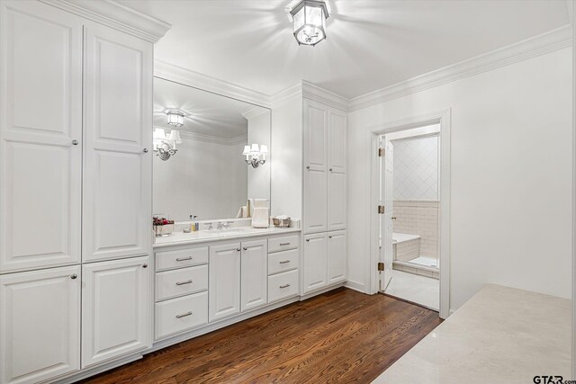 1920 Stonegate Blvd, Tyler, TX 75703 - bathroom featuring crown molding, wood finished floors, and vanity