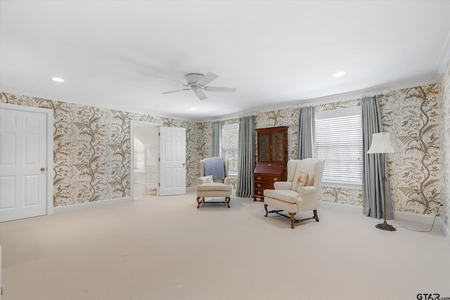 1920 Stonegate Blvd, Tyler, TX 75703 - living area with crown molding, carpet flooring, baseboards, wallpapered walls, and ceiling fan