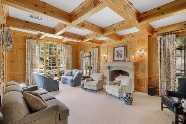 1920 Stonegate Blvd, Tyler, TX 75703 - carpeted living area featuring a warm lit fireplace, wood walls, visible vents, beam ceiling, and coffered ceiling