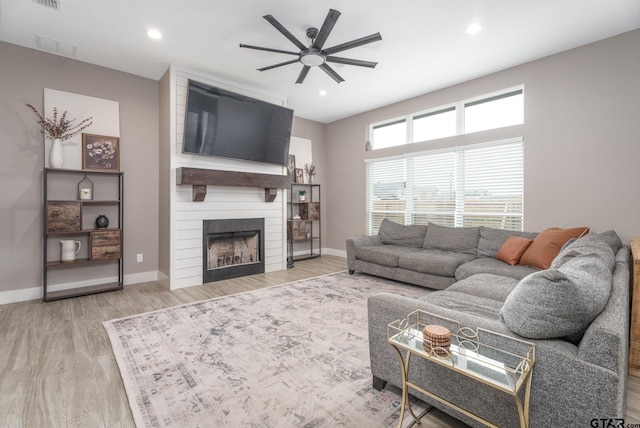 15365 Spring Oaks Dr, Lindale, TX 75771 - living room with ceiling fan, a large fireplace, wood finished floors, and recessed lighting
