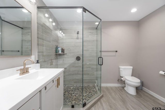 15365 Spring Oaks Dr, Lindale, TX 75771 - bathroom with vanity, wood finished floors, recessed lighting, and a shower stall