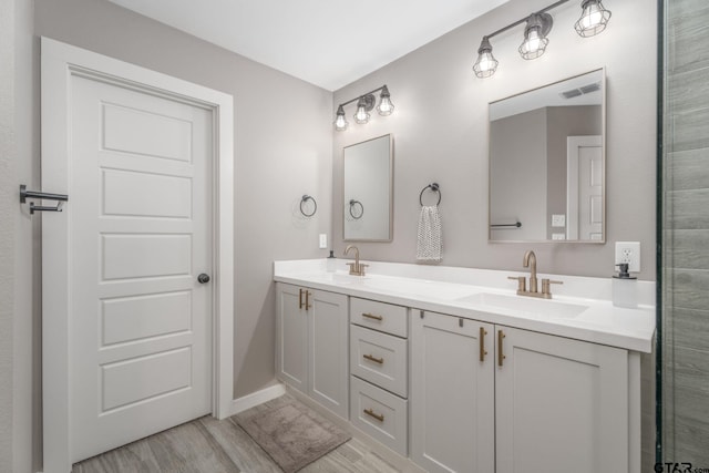 15365 Spring Oaks Dr, Lindale, TX 75771 - bathroom featuring wood finished floors and double vanity