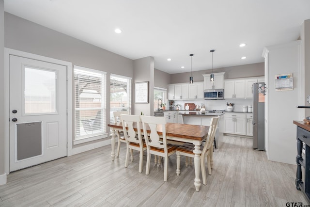 15365 Spring Oaks Dr, Lindale, TX 75771 - dining area featuring light wood-style flooring and recessed lighting