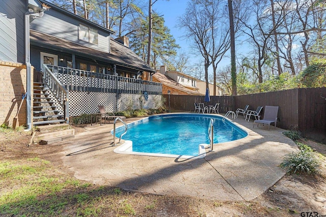 view of swimming pool with a patio