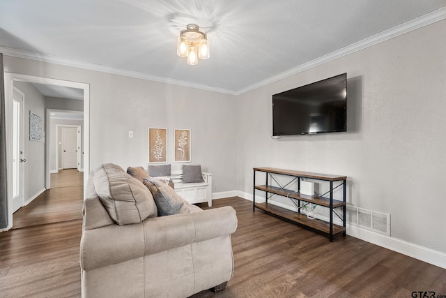 living room featuring hardwood / wood-style floors and ornamental molding