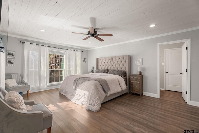 bedroom with ceiling fan, ornamental molding, dark wood-type flooring, and wooden ceiling