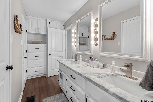 bathroom with vanity and wood-type flooring