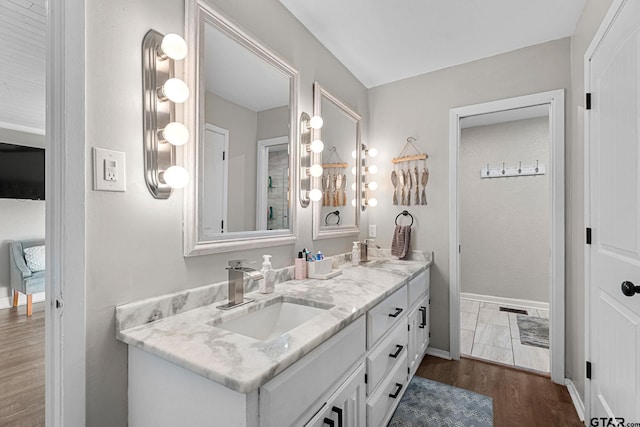 bathroom featuring vanity and wood-type flooring