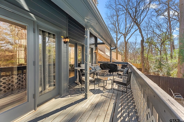 wooden terrace featuring area for grilling