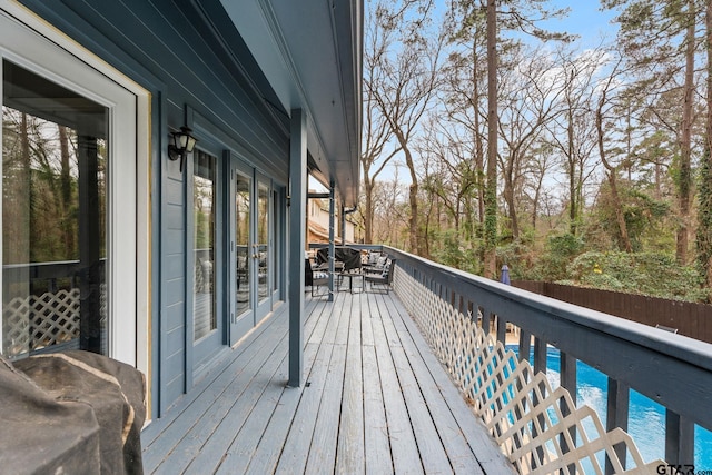 wooden deck featuring a pool