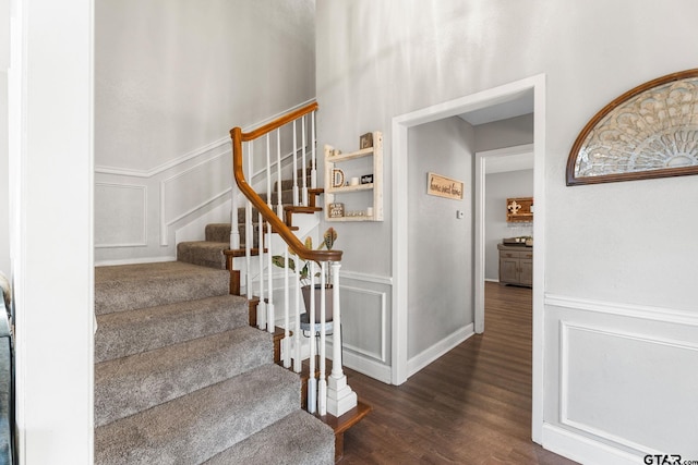 stairs with hardwood / wood-style floors