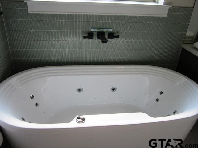 bathroom with a bathing tub