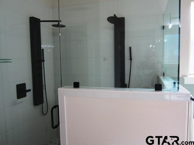 7924 Crooked Trl, Tyler, TX 75703 - bathroom with a shower stall and tile walls