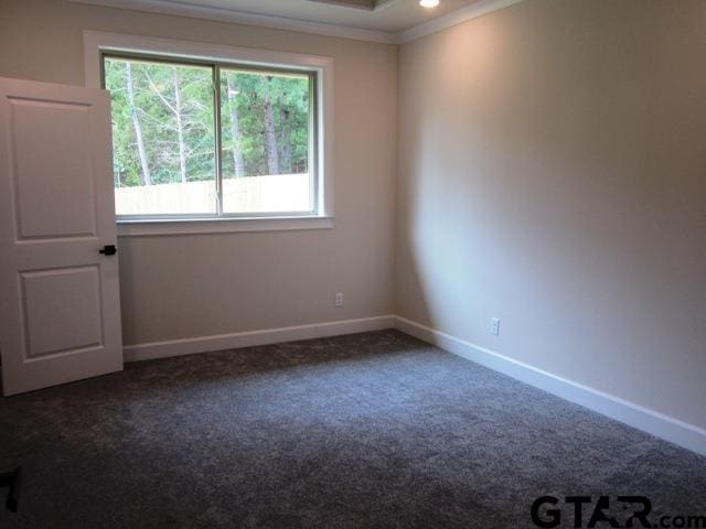 7924 Crooked Trl, Tyler, TX 75703 - unfurnished room featuring ornamental molding, dark carpet, and baseboards