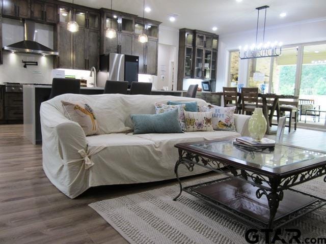 7924 Crooked Trl, Tyler, TX 75703 - living area with dark wood-style floors, recessed lighting, and a chandelier
