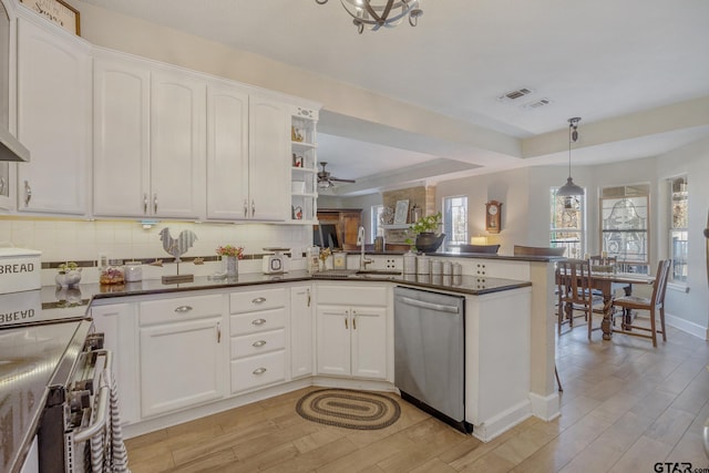 kitchen featuring kitchen peninsula, decorative light fixtures, stainless steel dishwasher, white cabinets, and sink