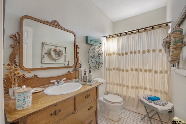 full bathroom with toilet, vanity, tile patterned floors, shower / bath combination with curtain, and a textured ceiling