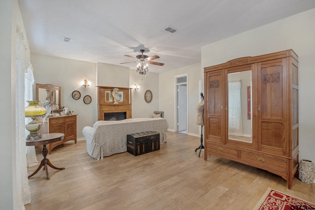 bedroom with ceiling fan and light wood-type flooring