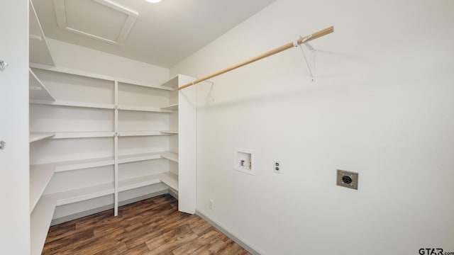 laundry area with dark hardwood / wood-style flooring, hookup for a washing machine, and hookup for an electric dryer