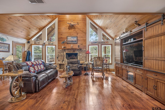 living room with wood walls, high vaulted ceiling, a wealth of natural light, and wood-type flooring