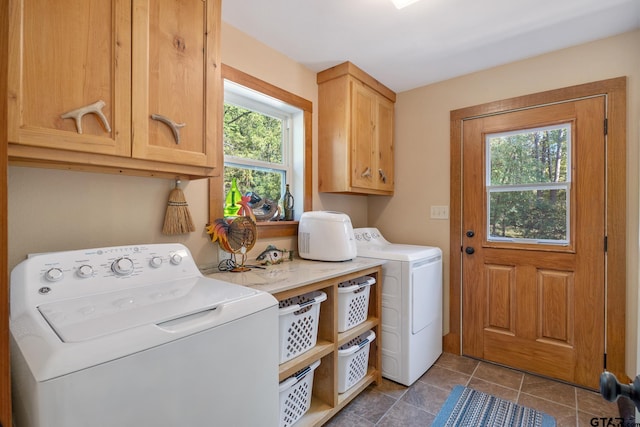 laundry area with cabinets, plenty of natural light, tile patterned floors, and washer and clothes dryer