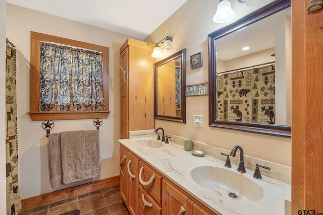 bathroom featuring tile patterned flooring and vanity