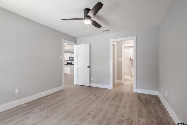 415 Thigpen Dr, Tyler, TX 75703 - unfurnished bedroom featuring light wood finished floors, baseboards, and ceiling fan