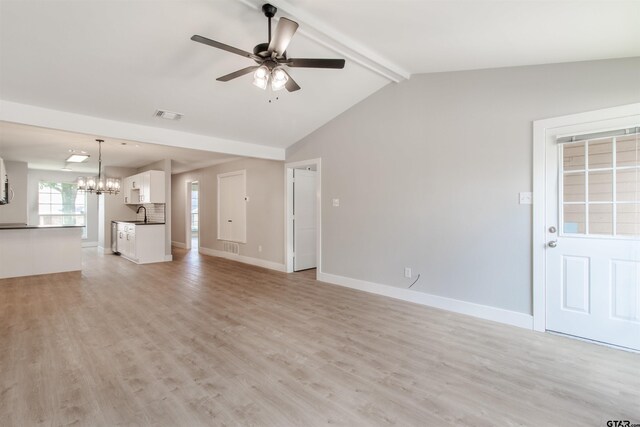 415 Thigpen Dr, Tyler, TX 75703 - unfurnished living room with a chandelier, a sink, ceiling fan, and light wood-style floors