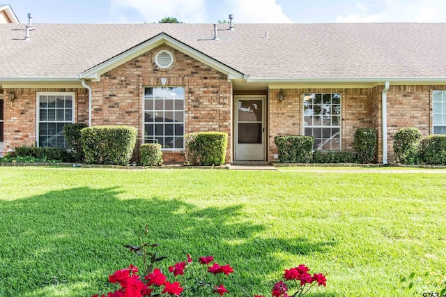 415 Thigpen Dr, Tyler, TX 75703 - single story home featuring brick siding, a shingled roof, and a front yard