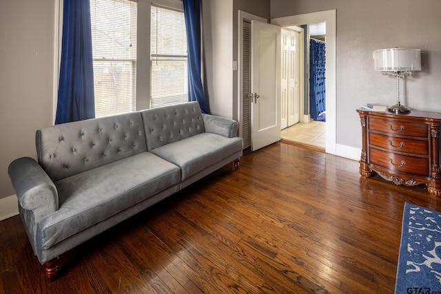 living room featuring wood finished floors and baseboards