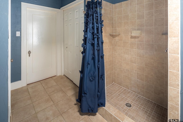 full bathroom featuring a stall shower and tile patterned floors