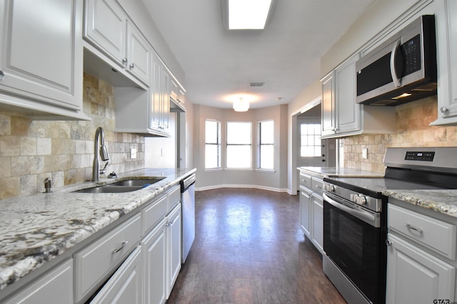 kitchen with white cabinets, sink, and stainless steel appliances