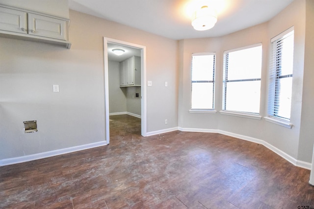 empty room with dark hardwood / wood-style floors