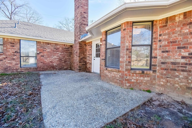 doorway to property with a patio area