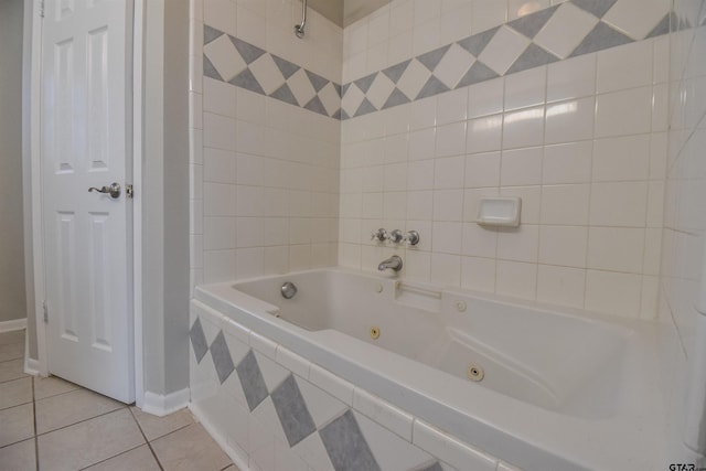 bathroom with tiled bath and tile patterned flooring