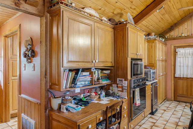 kitchen with light tile patterned floors, wood ceiling, black oven, and lofted ceiling with beams