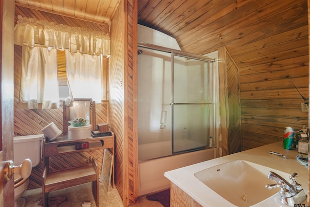 full bathroom with toilet, sink, wood ceiling, wooden walls, and enclosed tub / shower combo