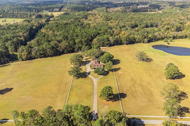 birds eye view of property with a water view and a rural view