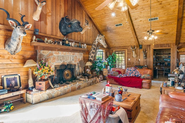 living room featuring a stone fireplace, light carpet, wooden ceiling, and wood walls