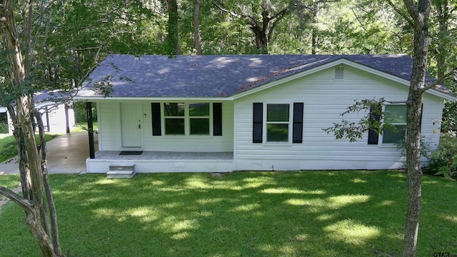 rear view of property with a yard