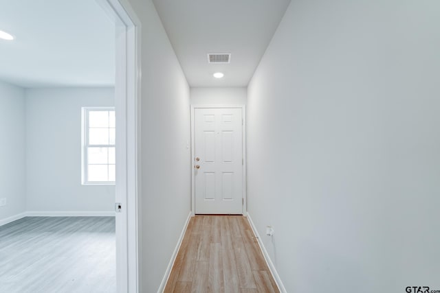 corridor featuring light hardwood / wood-style flooring