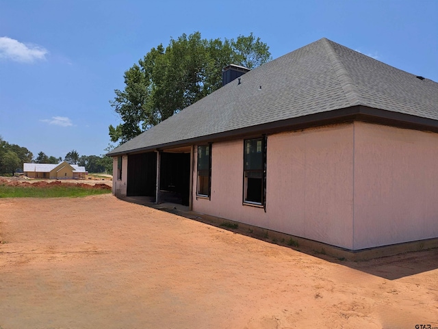 13990 Cedar Vis, Tyler, TX 75704 - view of property exterior featuring roof with shingles