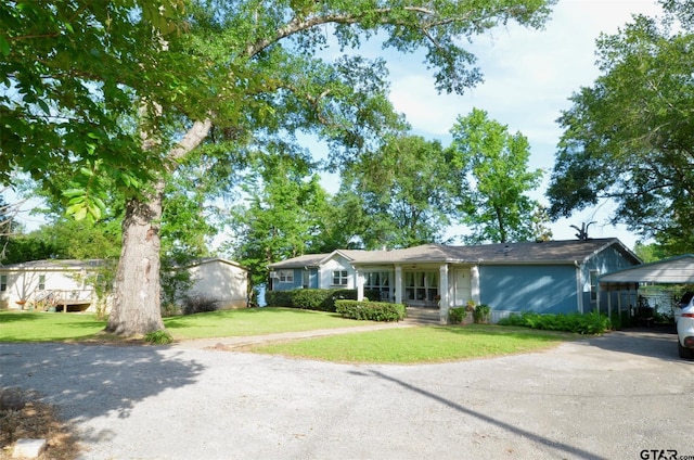 116 Piney Pt, Murchison, TX 75778 - ranch-style home with asphalt driveway, a front yard, and a porch