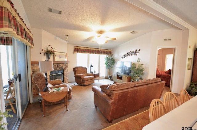 116 Piney Pt, Murchison, TX 75778 - living area with a ceiling fan, a fireplace, a textured ceiling, and crown molding
